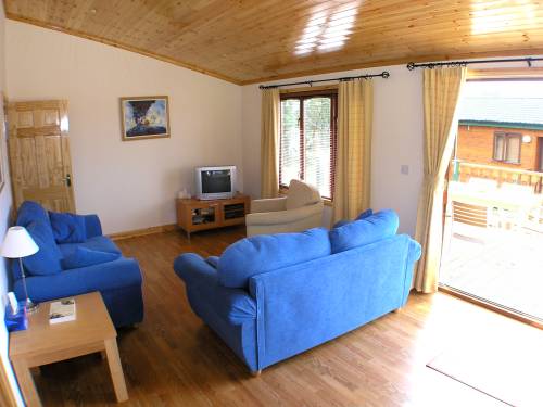 main living area with patio doors to wood deck area of The Cabin, Rockhill, Kerrykeel