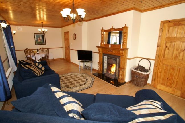 Comfortably furnished living room with wood floor