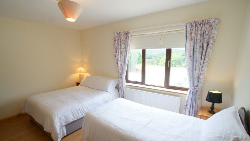 The ensuite family bedroom with double and single bed