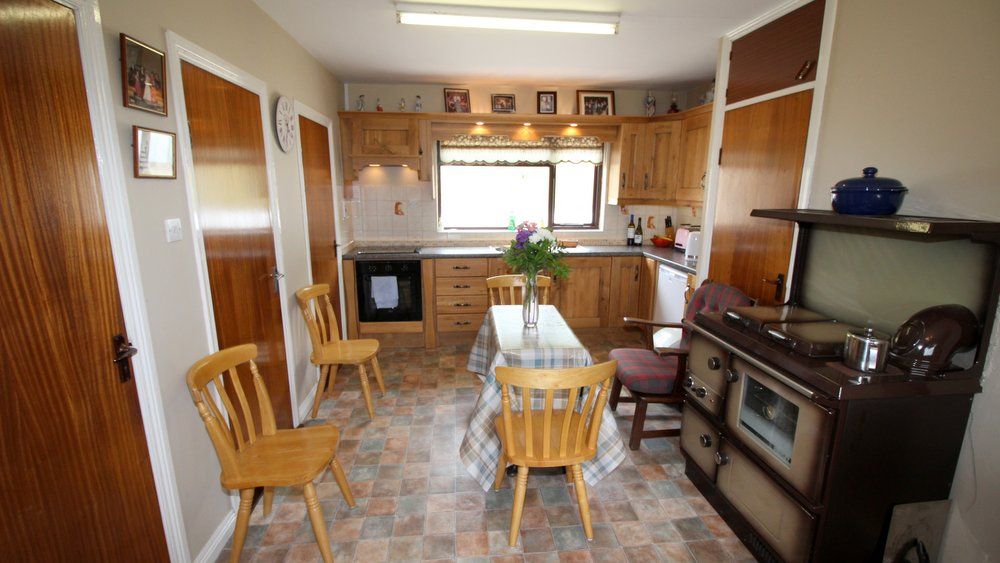 The kitchen and dining area with oil firedl range